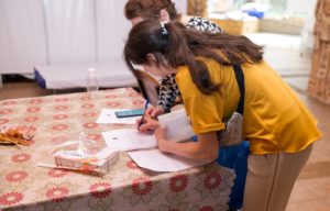 Families signing papwerwork