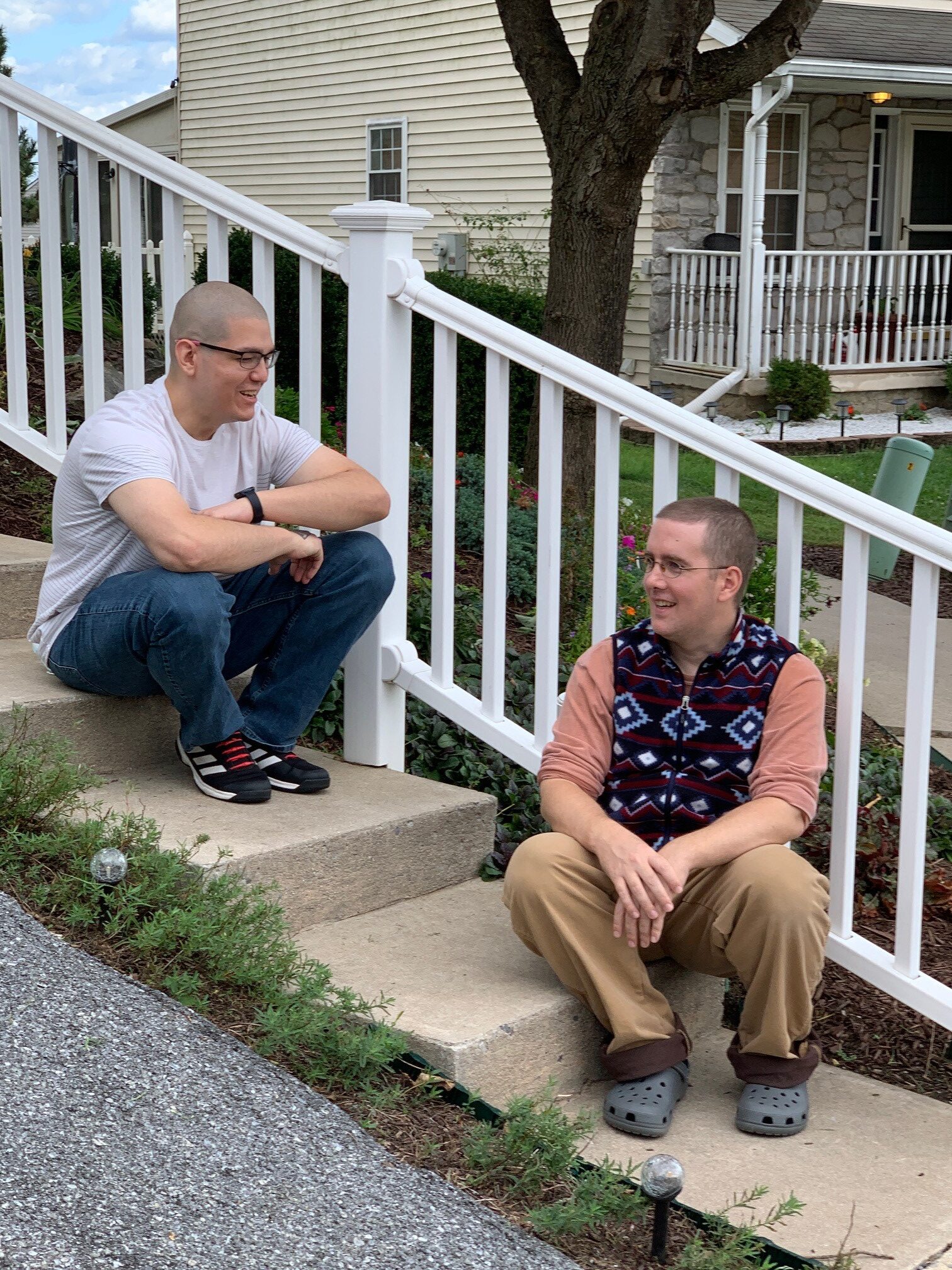 2 people sitting on steps