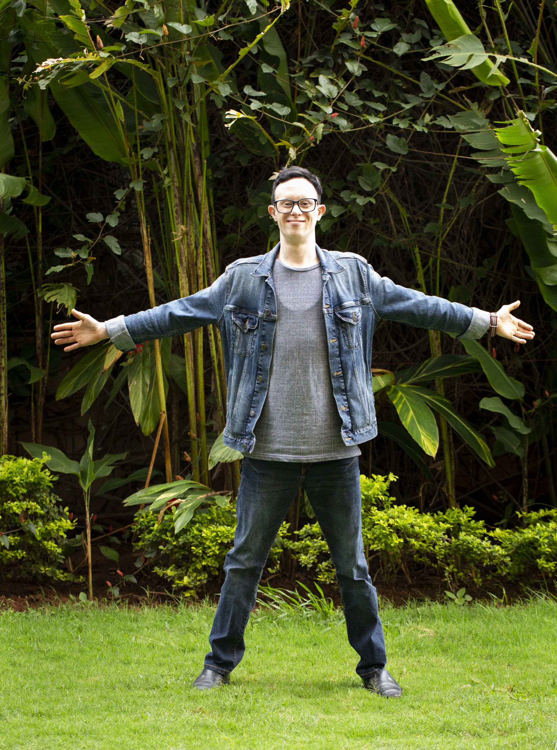 Man with arms spread wide